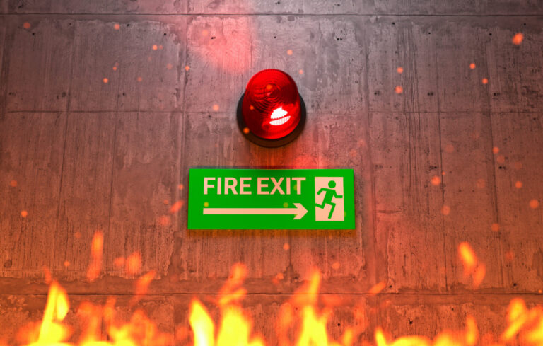 Emergency exit sign with alarm beacon for evacuation guidance